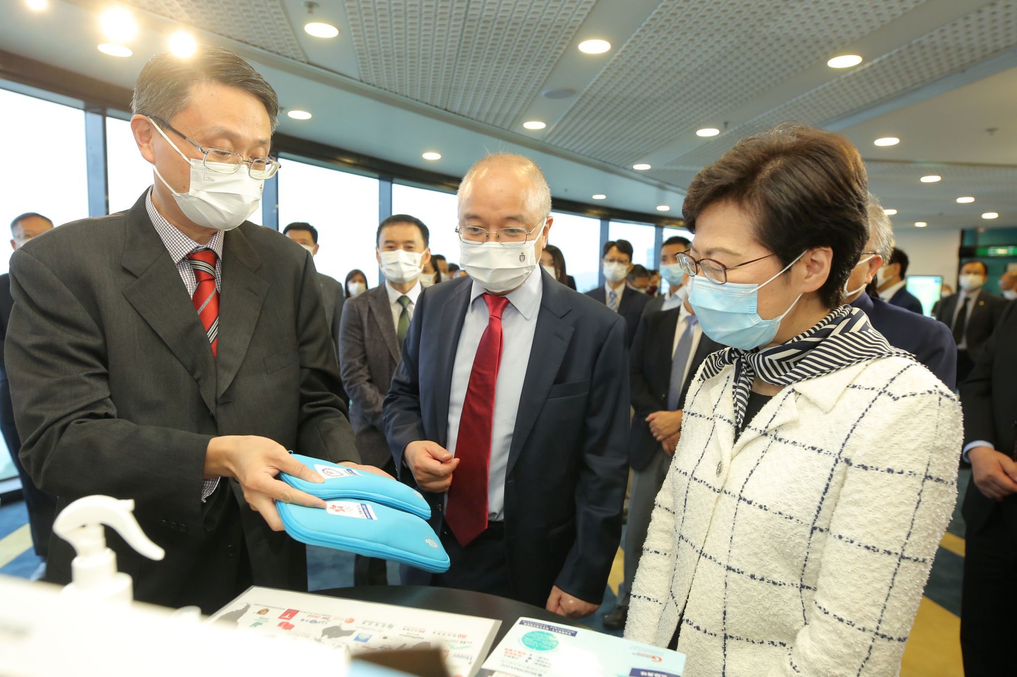 Prof. Yeung King-Lung (left) and Prof. Wang Yang (middle) introduce GERMAGIC, the commercialization of a germicidal technology developed by HKUST.