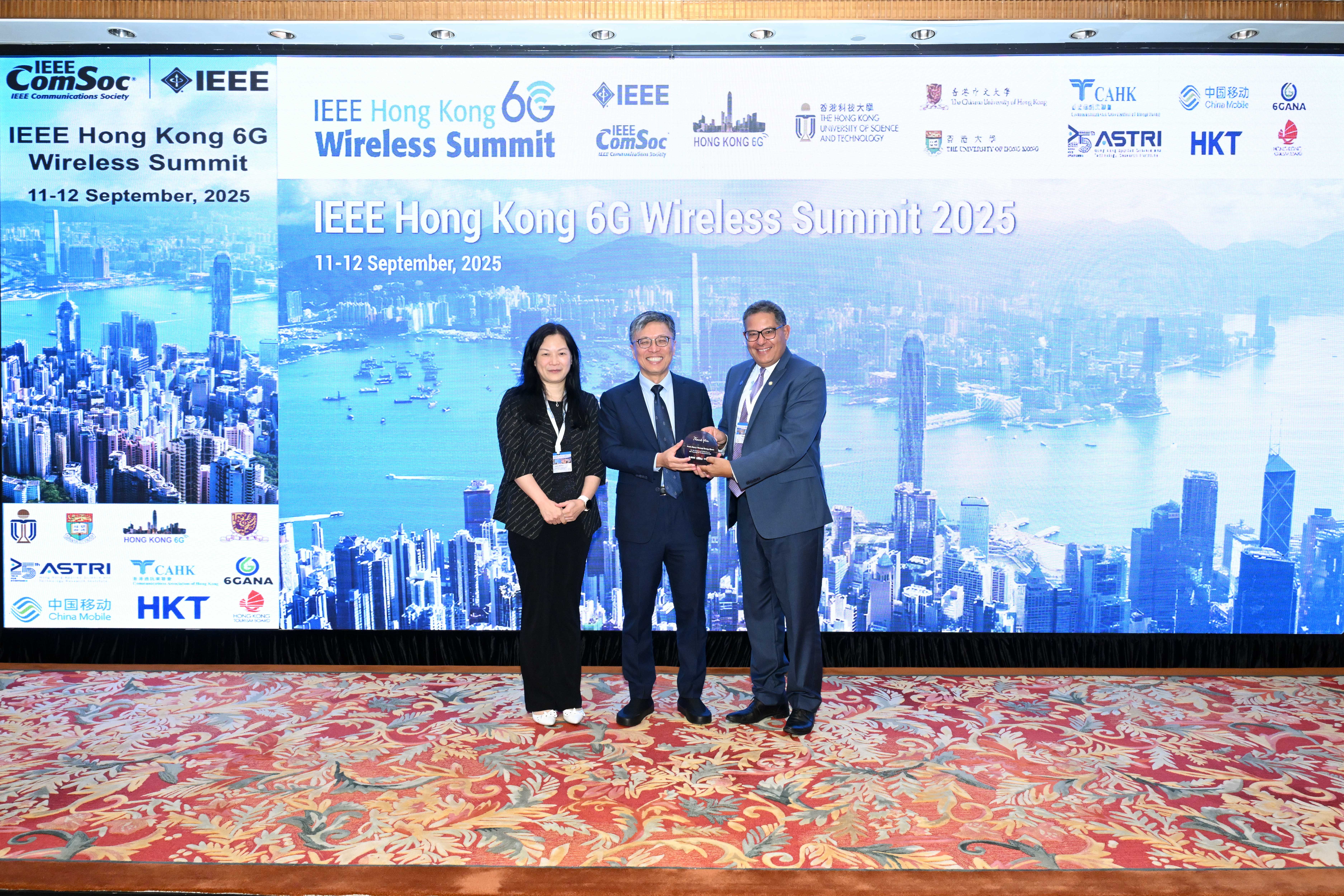 A group photo of Prof. Harry SHUM (center), HKUST Council Chairman, Prof. Khaled B. LETAIEF (right), HKUST New Bright Professor of Engineering and Chair Professor of the Department of Electronic and Computer Engineering and Prof. ZHANG Qian (left), Head of Division of Integrative Systems and Design.
